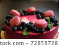 Delicious cake with fresh strawberries, raspberries, blueberry, currants. cut piece of cake and blade on wooden background. 72858728