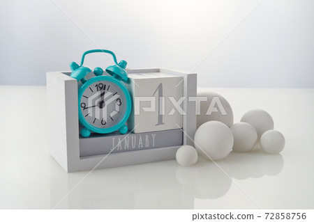1 january wooden calendar with decorations on white table background 1 january wooden calendar with decorations on white table background 72858756