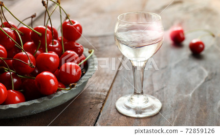 Fresh cherry and a shot with Kirsch or Kirschwasser 72859126