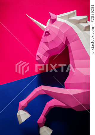 Paper unicorn head on a colored background. Paper unicorn head on a colored background. 72859281