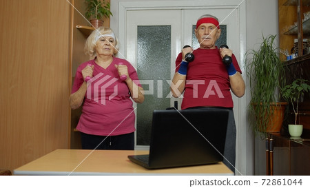 Elderly man woman doing fitness exercises starting live stream, vlog, blog, online distance course 72861044