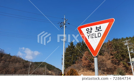 Roadside signs and telephone poles in Korea~ 72864734