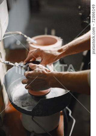A man processes a bottle into a glass A man processes a bottle into a glass 72866149