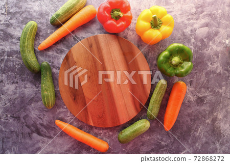 fresh vegetables, cutting board on table  72868272