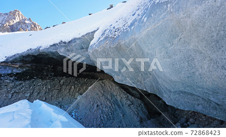 Ice cave in the snowy mountains. Tuyuk-Su glacier 72868423