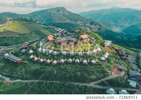 Aerial view of camping grounds and tents on Doi Mon Cham mountain in Mae Rim, Chiang Mai province Aerial view of camping grounds and tents on Doi Mon Cham mountain in Mae Rim, Chiang Mai province 72869551