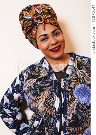 beauty bright african woman with creative make up, shawl on head like cubian closeup smiling beauty bright african woman with creative make up, shawl on head like cubian closeup smiling 72870144