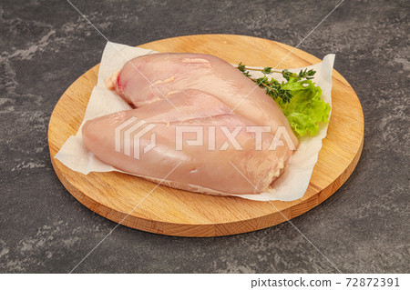 Raw chicken breast over board 72872391