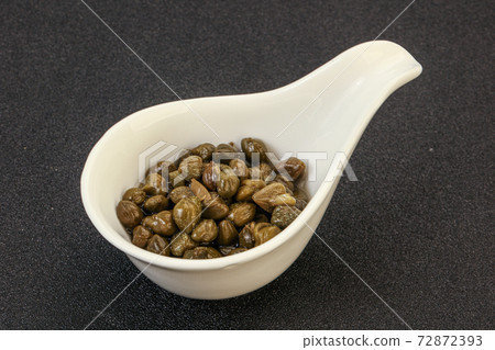 Tasty capers in the bowl 72872393