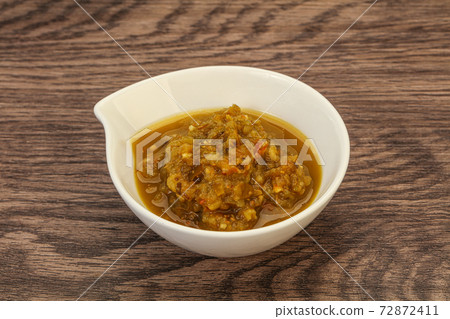 Green spicy sauce in the bowl Green spicy sauce in the bowl 72872411