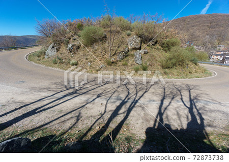 Wide angle view of mountain hairpin bend curved road Wide angle view of mountain hairpin bend curved road 72873738