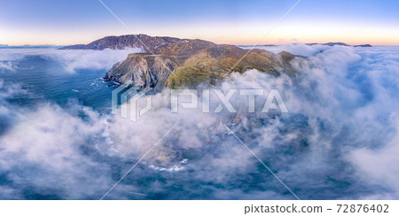 Dramatic aerial view of the Slieve League cliffs in County Donegal, Ireland Dramatic aerial view of the Slieve League cliffs in County Donegal, Ireland 72876402