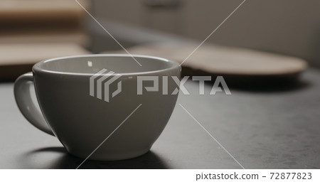 white cup on concrete countertop with copy space 72877823
