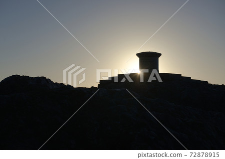 3 - Sun rises behind toposcope at the summit of the malvern hills 72878915