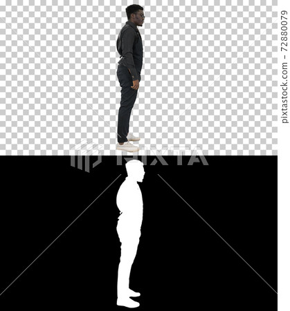 Young African American businessman in glasses standing and pulli Young African American businessman in glasses standing and pulli 72880079