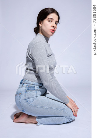 Dark hair caucasian girl on grey Dark hair caucasian girl on grey 72881684