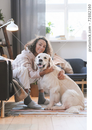 Woman loving her dog Woman loving her dog 72882160
