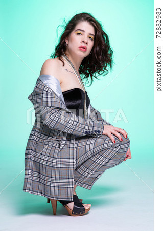 Dark hair caucasian girl on green 72882983