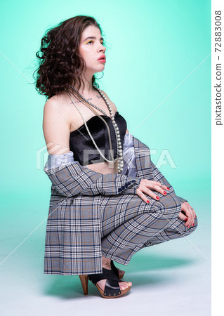 Dark hair caucasian girl on green Dark hair caucasian girl on green 72883008