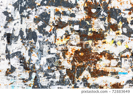 Weathered rusty metal texture with scraps of old paper as background Weathered rusty metal texture with scraps of old paper as background 72883649
