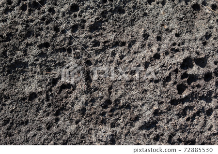 The surface of a rock that is dented in the shape of a hole due to the splash of waves The surface of a rock that is dented in the shape of a hole due to the splash of waves 72885530