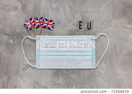 White medical face mask, UK flag and EU sign White medical face mask, UK flag and EU sign 72886638
