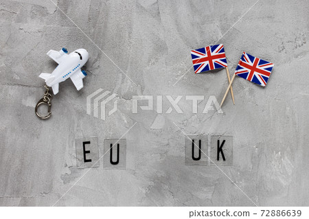 Airplane model, UK flags and text EU UK Airplane model, UK flags and text EU UK 72886639