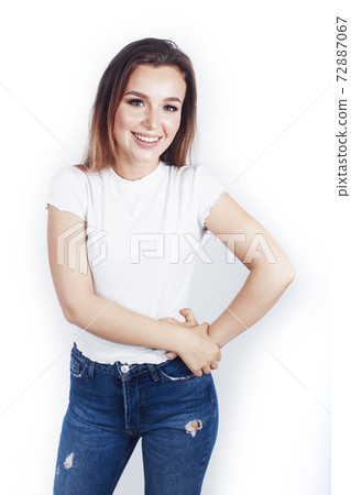 young blond woman on white backgroung gesture thumbs up, isolated emotional posing 72887067