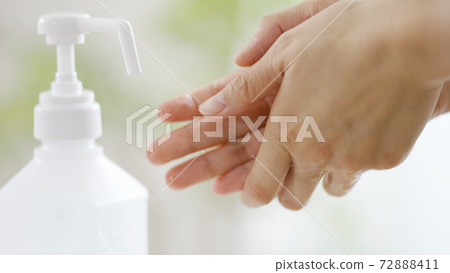Women's hands wearing alcohol spray Women's hands wearing alcohol spray 72888411