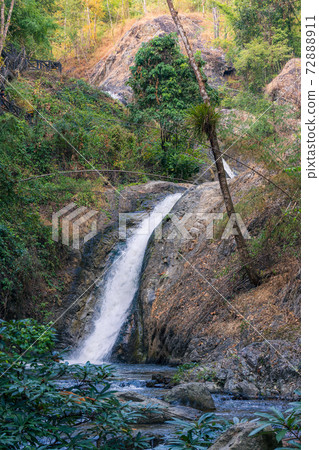Chae son waterfall at chae son nation park, Lampang Thailand - Beautiful waterfall landscape. 72888911
