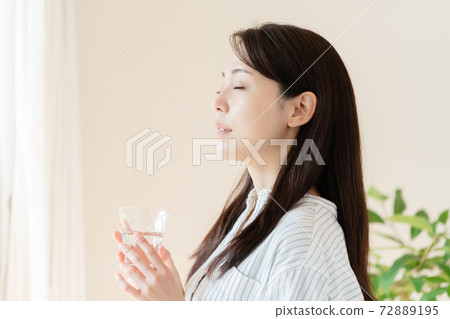 A young woman rehydrating A young woman rehydrating 72889195