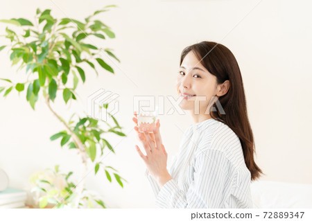 A young woman rehydrating A young woman rehydrating 72889347