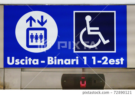 Closeup sign board shows direction to railway train station platform 1, platform 2 and exit on lift for people with disabilities. Information sign directing upstairs Closeup sign board shows direction to railway train station platform 1, platform 2 and exit on lift for people with disabilities. Information sign directing upstairs 72890121