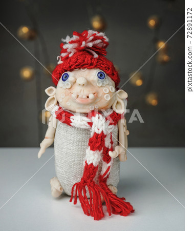 handmade toy made of polymer clay spirit of Christmas in knitted hat and scarf 72891172