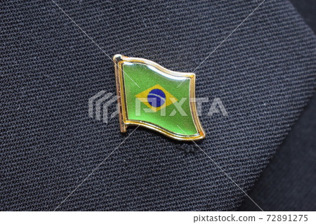 Brazil flag lapel pin on a suit 72891275
