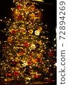 A warm Christmas tree light 72894269