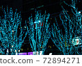 Blue Christmas illuminations lit in the night sky 72894271