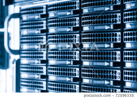 Cluster of data storage hard drives inside server room 72896338