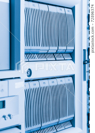 Cluster of data storage hard drives inside server room 72896374