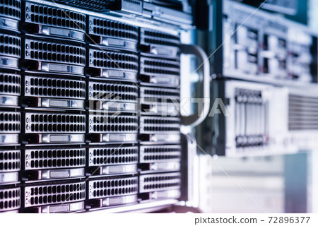 Cluster of data storage hard drives inside server room 72896377
