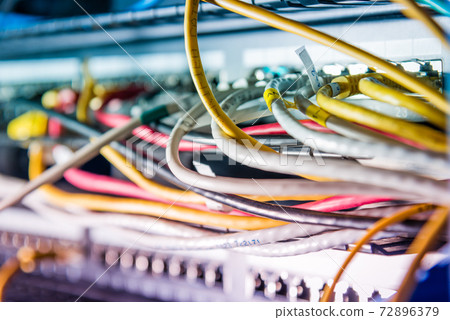 Server with patch cables plugged in ethernet ports Server with patch cables plugged in ethernet ports 72896379