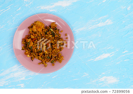 Mung beans cooking with Turkey and tomatoes. on a blue background 72899056