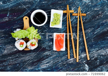 vegetarian sushi rolls with lettuce tomato cucumber, ginger, wasabi 72899062