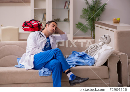 Young male paramedic visiting skeleton patient Young male paramedic visiting skeleton patient 72904326