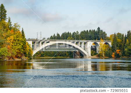 Autumn landscape of bridge and Kymijoki river waters in Finland, Kouvola, Koria Autumn landscape of bridge and Kymijoki river waters in Finland, Kouvola, Koria 72905031