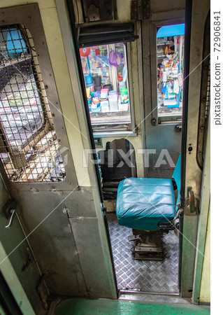 The train driver's cab in the old train standing at railway station. The train driver's cab in the old train standing at railway station. 72906841