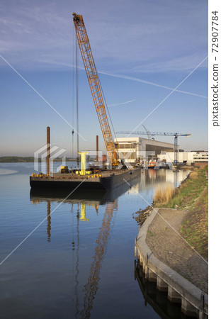 Floating crane in a river 72907784