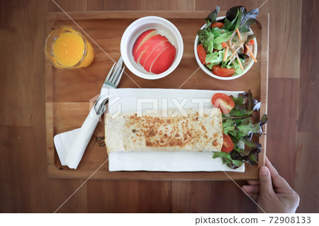 orange juice and taco ,vegetable roll or salad roll or burrito orange juice and taco ,vegetable roll or salad roll or burrito 72908133