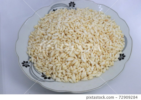 tasty and healthy puffed rice stock on plate 72909284