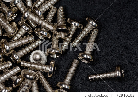 Lots of small tapping screws (black background) Lots of small tapping screws (black background) 72910192